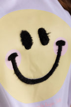 OVERSIZED  CARA FELIZ APLIQUE PELUDO